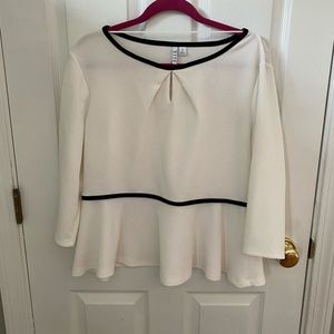 Cream and black peplum blouse